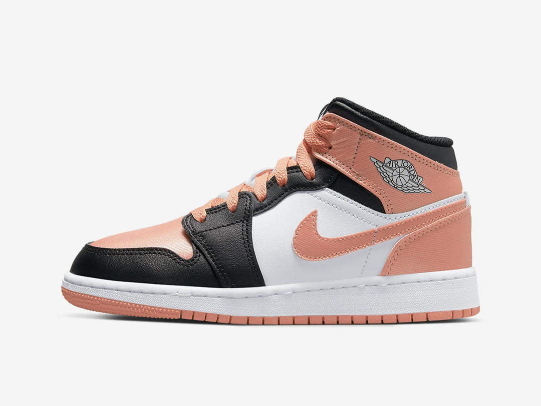 Timeless Air Jordan 1 Mid sneakers in a classic pink, white and black colour scheme.