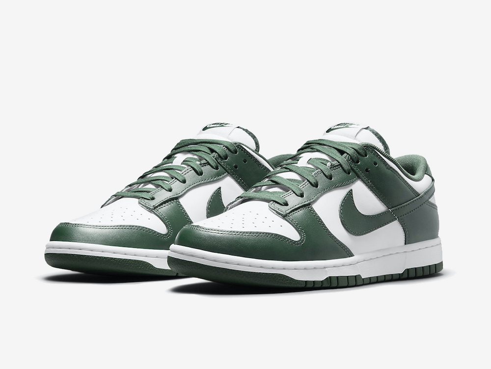 Classic Nike Dunk shoes with a white and green colourway.
