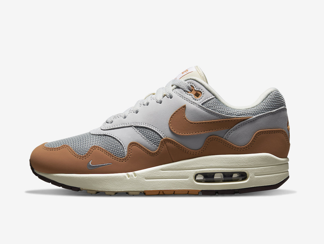 Timeless Air Max 1 sneakers in a classic white and orange colour scheme.