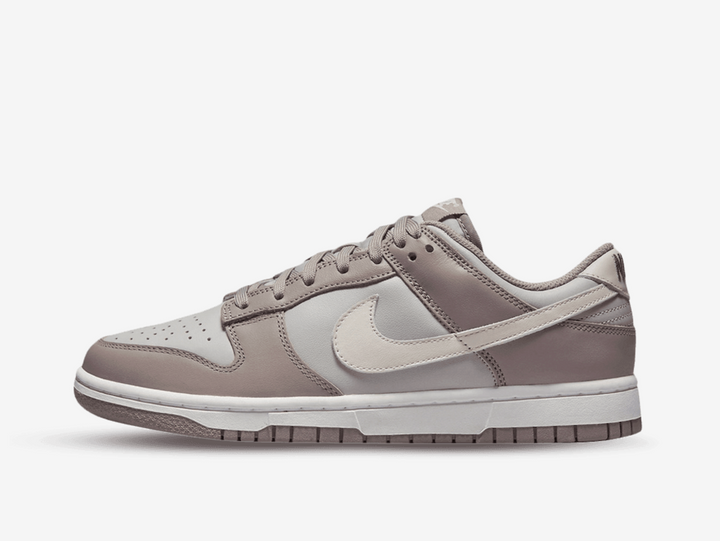 Timeless Nike Dunk sneakers in a classic grey and brown colour scheme.