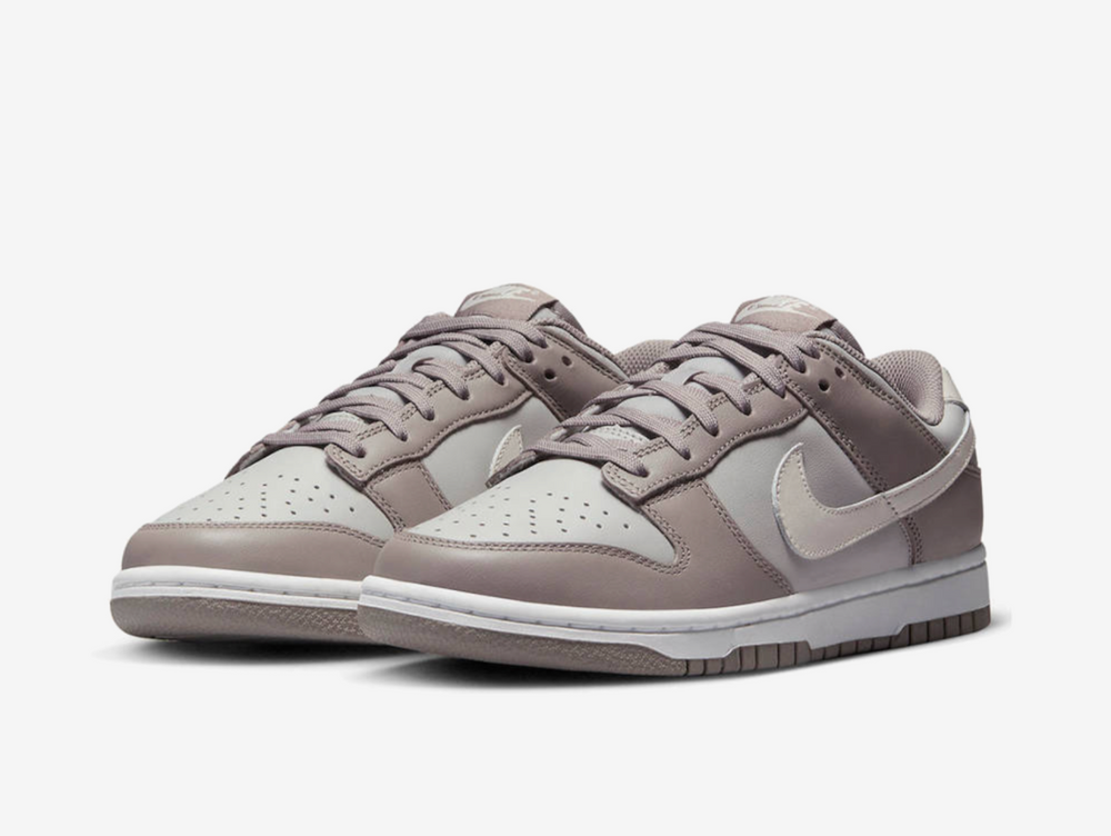 Timeless Nike Dunk sneakers in a classic grey and brown colour scheme.