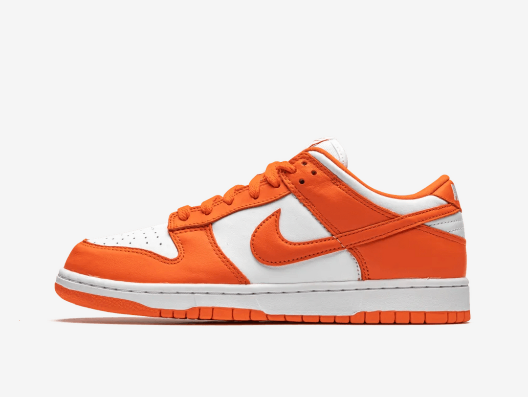 Classic Nike Dunk shoes with a white and orange colourway.