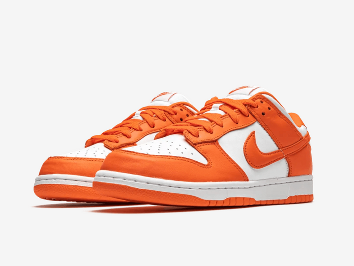 Classic Nike Dunk shoes with a white and orange colourway.