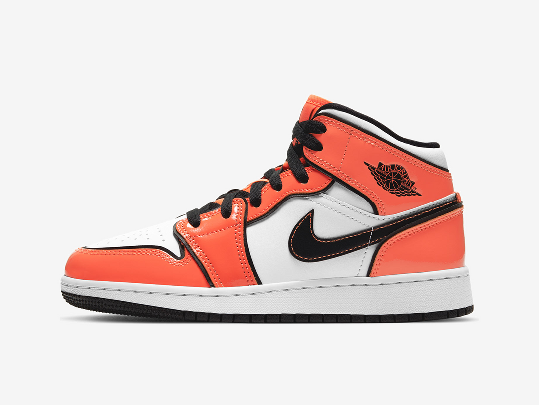 Exclusive Jordan 1 Mid shoes with a unique orange and white colour scheme.