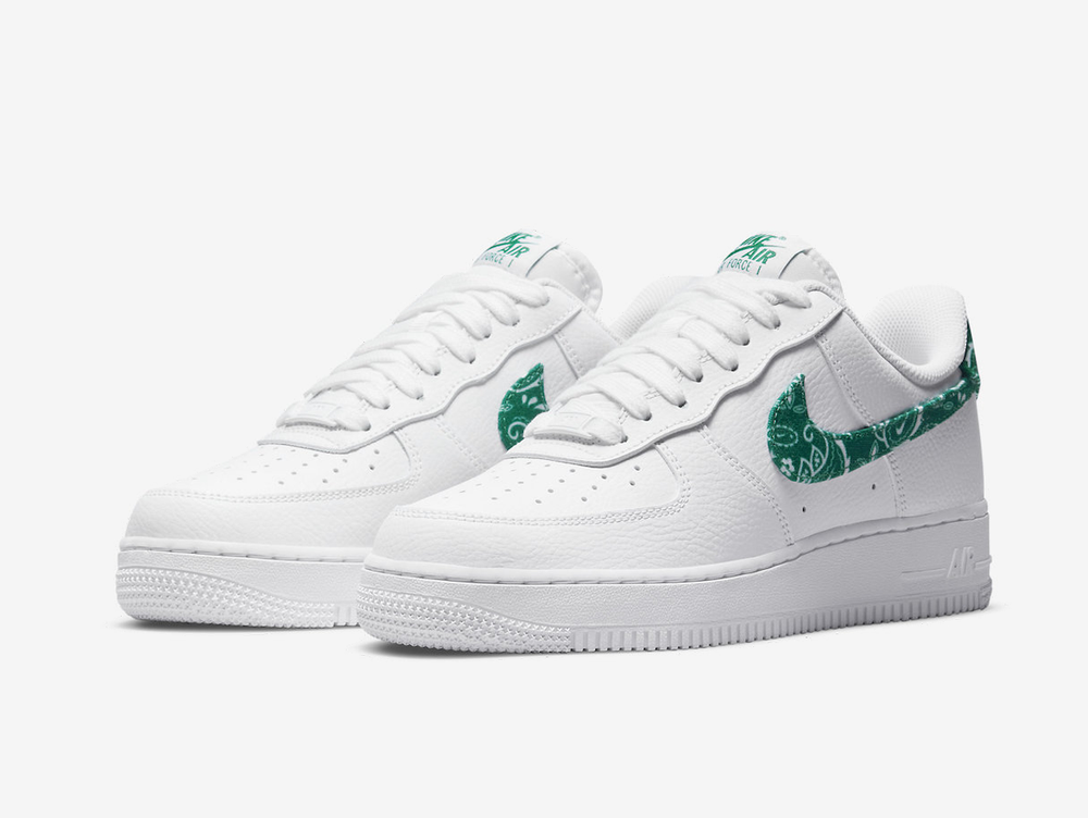 Classic Nike shoes with a white and green colourway.