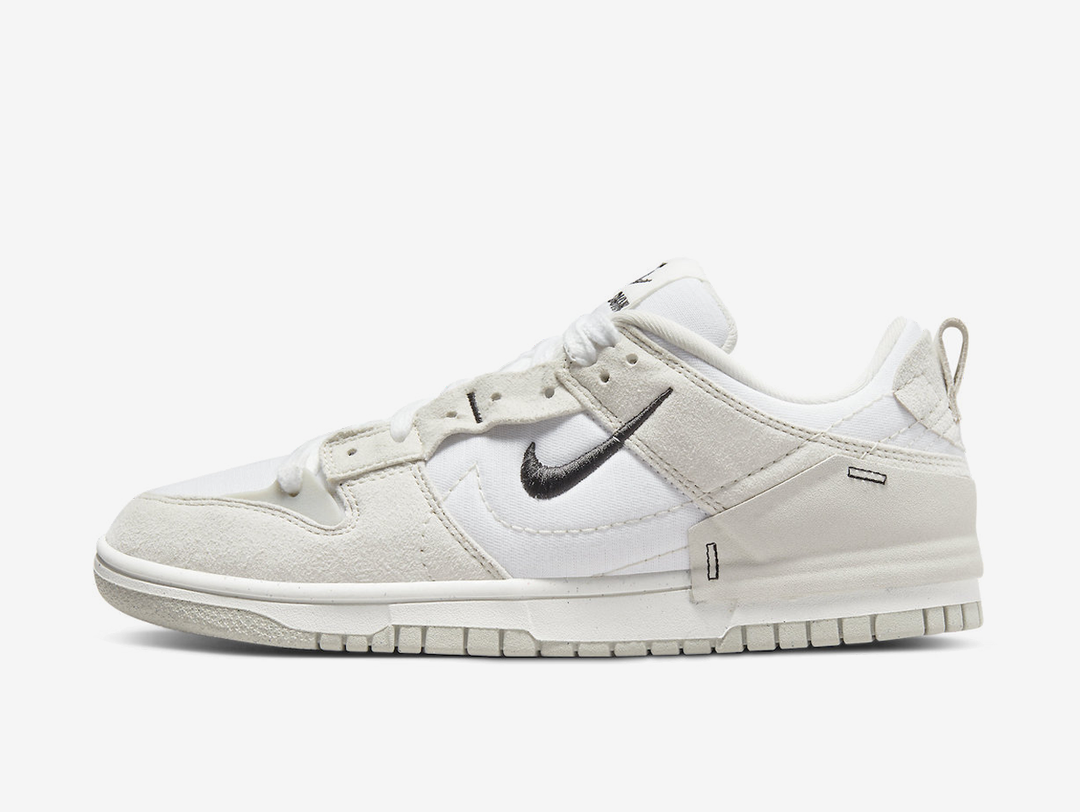Classic Nike Dunk shoes with a white and cream colourway.