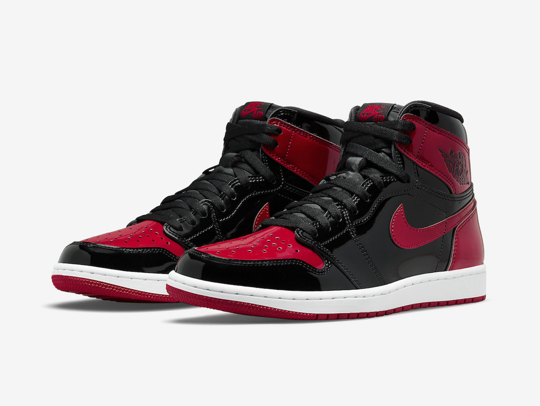 Timeless Air Jordan 1 High sneakers in a classic red and black colour scheme.