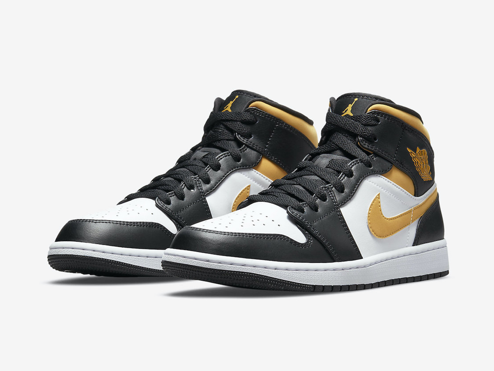 Classic Jordan 1 Mid shoes with a yellow, white, and black colourway.