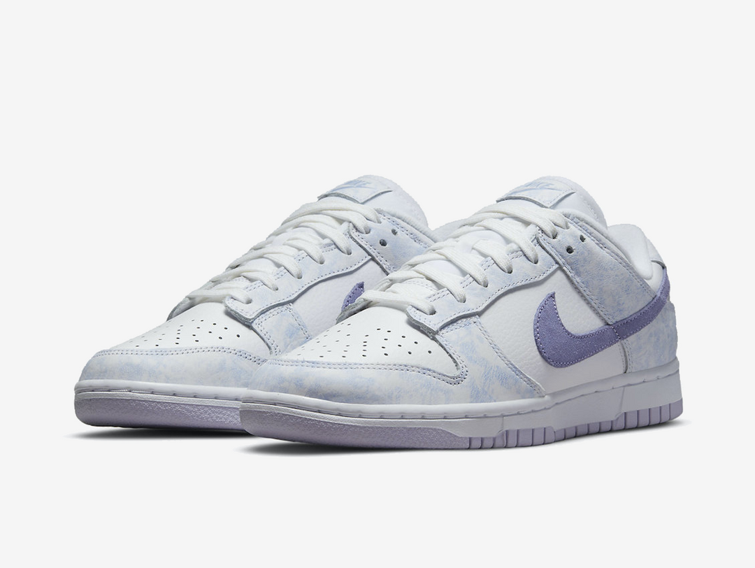 Classic Nike Dunk shoes with a white and purple colourway.