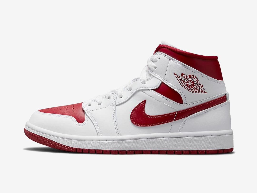 Timeless Air Jordan 1 Mid sneakers in a classic white and red colour scheme.