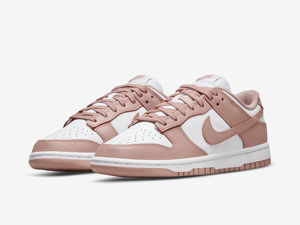 Timeless Nike Dunk sneakers in a classic white and pink colour scheme.