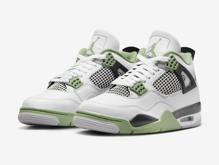Classic Jordan 4 shoes with a green, white, and black colourway.