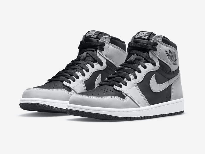 Timeless Air Jordan 1 High sneakers in a classic grey and black color scheme.  Edit alt text