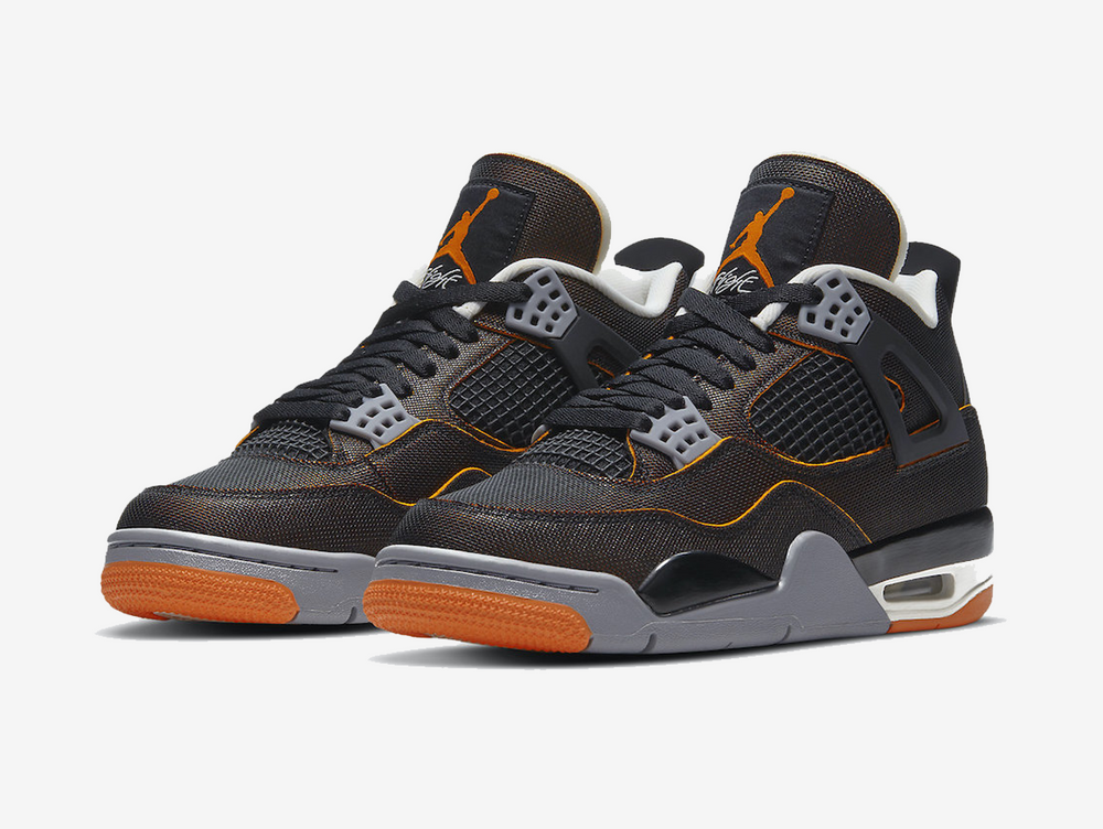 Classic Jordan 4 shoes with a orange, white, and black colourway.