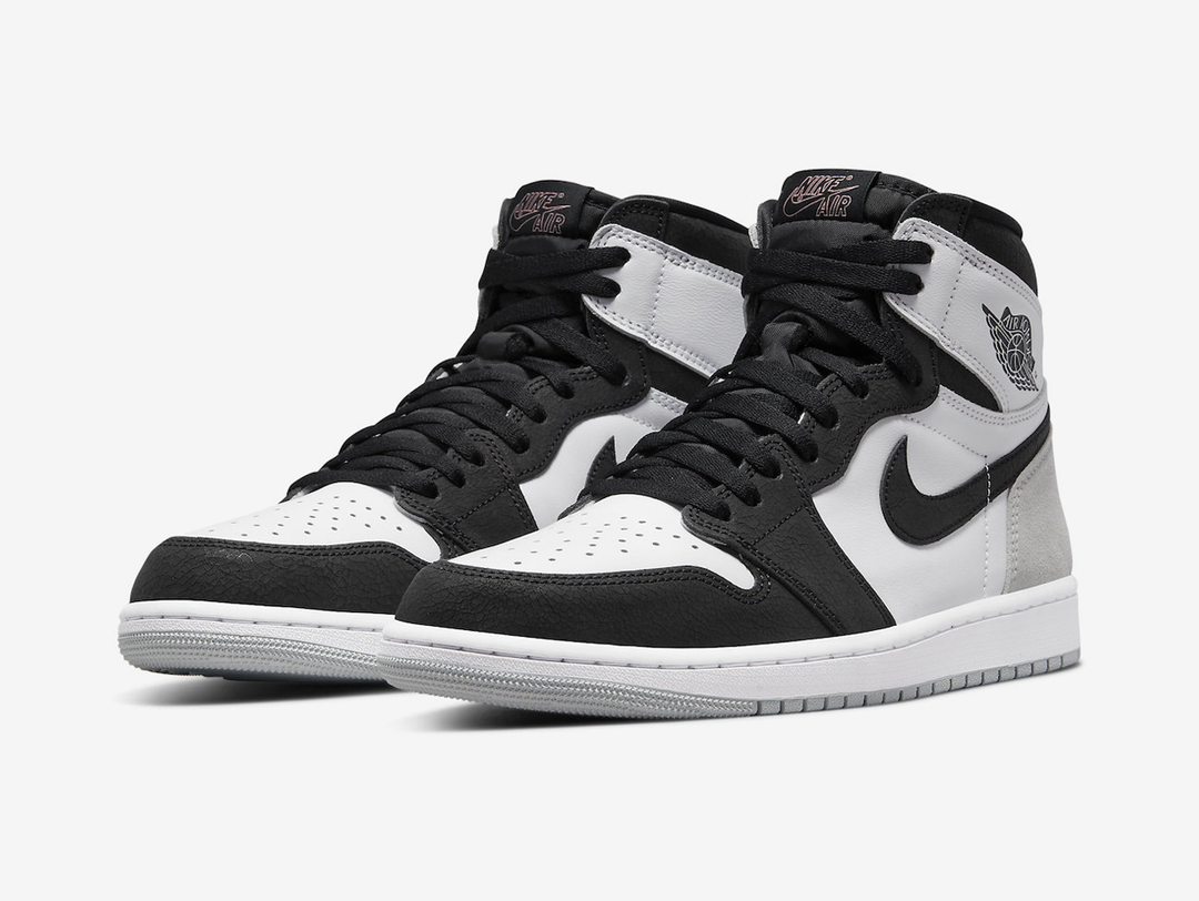 Timeless Air Jordan 1 High sneakers in a classic white and black color scheme.