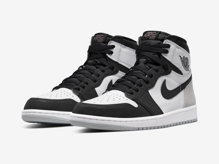 Timeless Air Jordan 1 High sneakers in a classic white and black color scheme.
