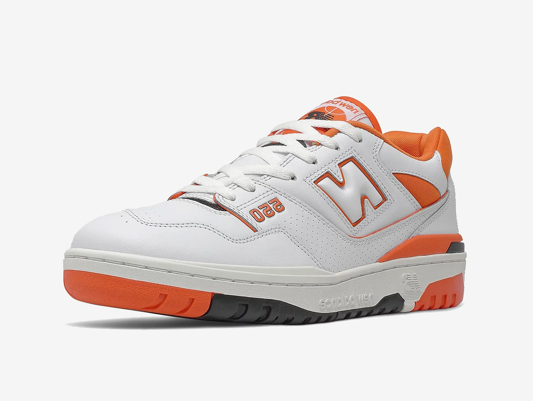 Classic New Balance shoes with a white and orange colourway.