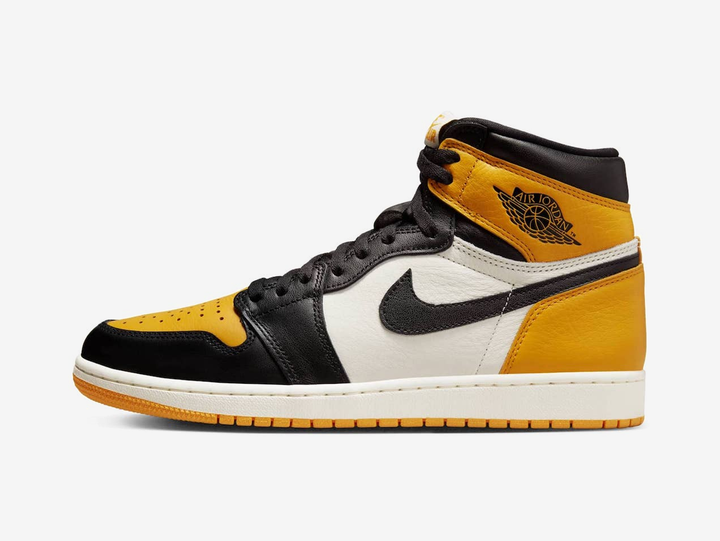Classic Jordan 1 High shoes with a yellow, white, and black colourway.