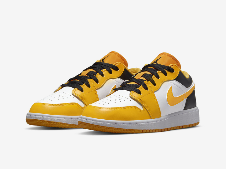 Timeless Air Jordan 1 Low sneakers in a classic yellow and white colour scheme.