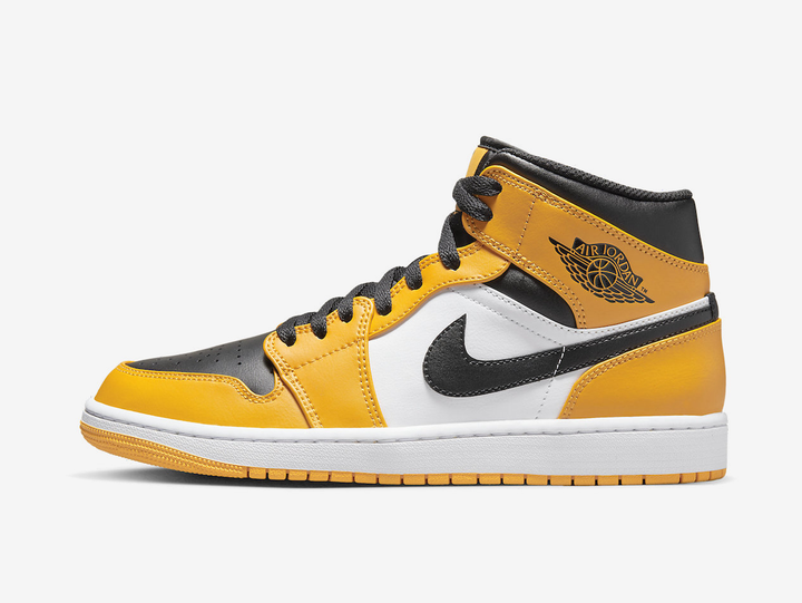 Timeless Air Jordan 1 Mid sneakers in a classic yellow, white and black colour scheme.