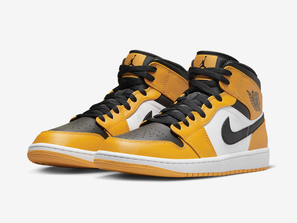 Timeless Air Jordan 1 Mid sneakers in a classic yellow, white and black colour scheme.