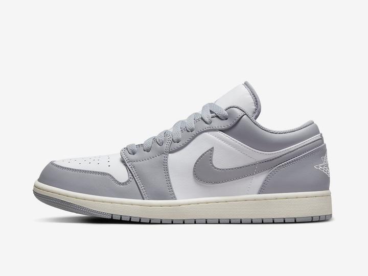 Timeless Air Jordan 1 Low sneakers in a classic grey and white colour scheme.