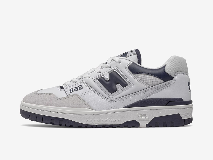 Classic New Balance shoes with a grey, white, and blue colourway.