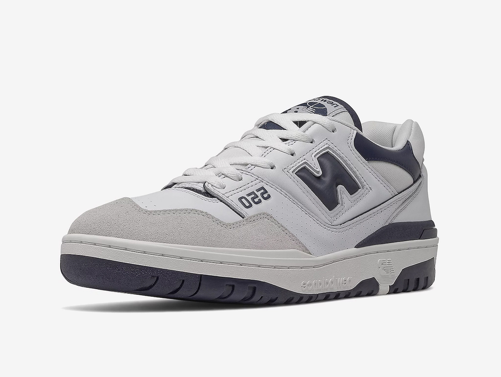 Classic New Balance shoes with a grey, white, and blue colourway.