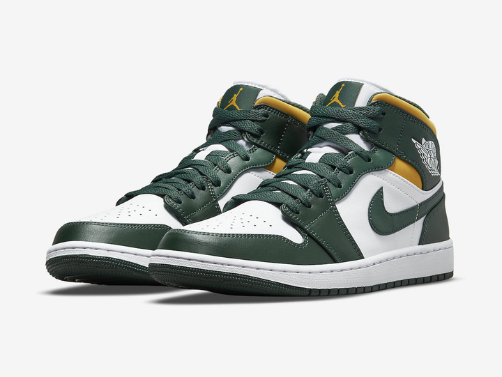 Classic Jordan 1 Mid shoes with a green, yellow, and white colourway.